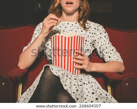 Similar – Image, Stock Photo Cheerful young woman watching a movie