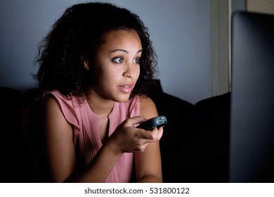Young Woman Watching Television At Night