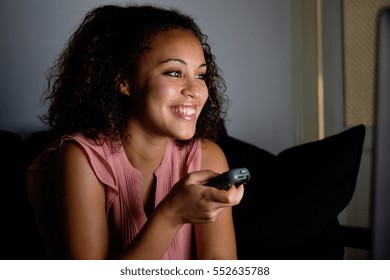 Young Woman Watching Television At Night