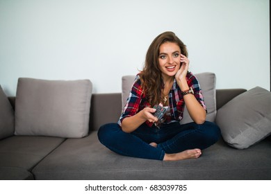 Young Woman Watching Tv In The Room