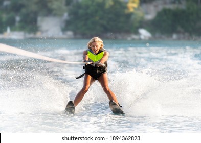 Young Woman Water Skiing On A Sea