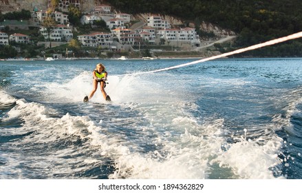 Young Woman Water Skiing On A Sea