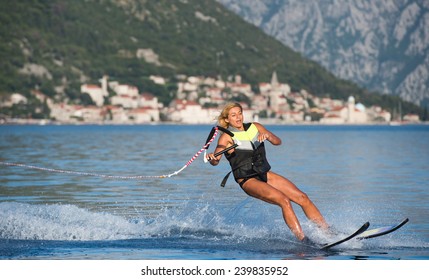 Young Woman Water Skiing On A Sea