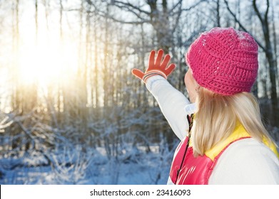 Young Woman Waving Goodbye To Winter