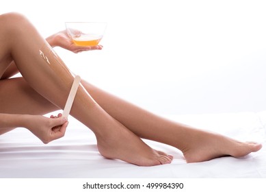 Young Woman Waxing Her Lower Leg