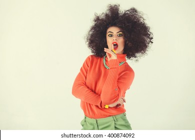 Young Woman Wearing A 70s Retro Clothes Striking A Pose In Studio. Disco Diva