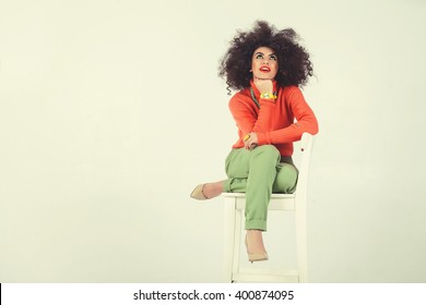 Young Woman Wearing A 70s Retro Clothes Striking A Pose In Studio. Disco Diva