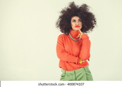 Young Woman Wearing A 70s Retro Clothes Striking A Pose In Studio. Disco Diva