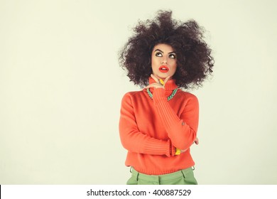 Young Woman Wearing A 70s Retro Clothes Striking A Pose In Studio. Disco Diva