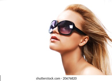 Young Woman Wearing The Big Modern Sunglasses. Studio Shot On A White Background