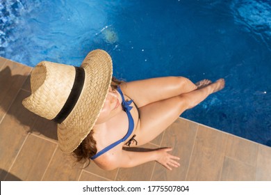 Young Woman Wearing Bikini In Summer With Thick Legs Enjoying At The Pool In Summer