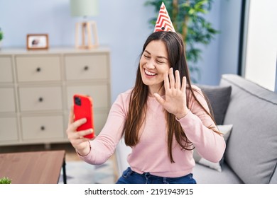 Young Woman Wearing Birthday Hat Having Video Call At Home