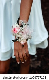 Young Woman Wearing A Corsage Before Prom.