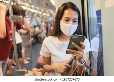 Young woman wearing face mask in public transporation BTS Skytrain, Healthy concept