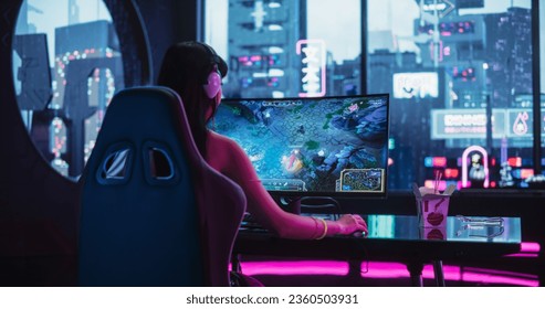 Young Woman Wearing Futuristic White Clothes and Neon Rings, Playing Online Strategy Video Game on a Computer with Curved Monitor. Beautiful Girl in Headphones Participating in an eSports Match
