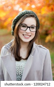 Young Woman Wearing Glasses Smiling In The Fall