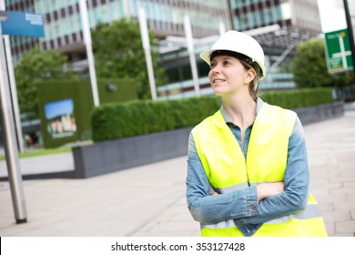 Young Woman Wearing A Hard Hat And Yellow Jacket