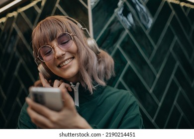 Young Woman Wearing Headphones Enjoying Listening Stock Photo ...