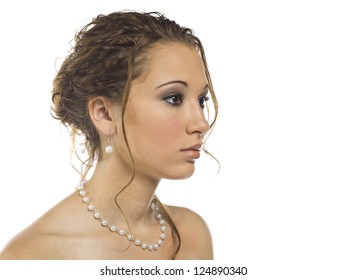 A Young Woman Wearing Matching Pearl Earrings And Necklace