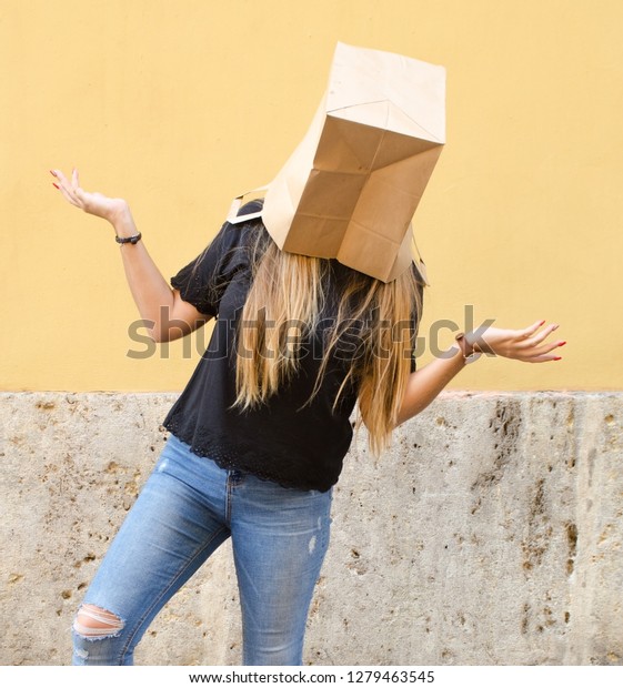 Download Young Woman Wearing Paper Bag Over Stock Photo Edit Now 1279463545 PSD Mockup Templates