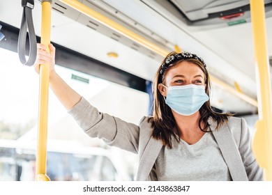 A Young Woman Wearing Protective Mask Commuting By The Public Bus