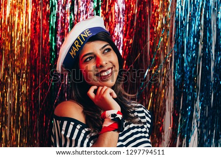 Young woman wearing sailor costume celebrating the carnival party
