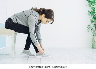 Young woman wearing shoes. Fitness. Training. - Powered by Shutterstock