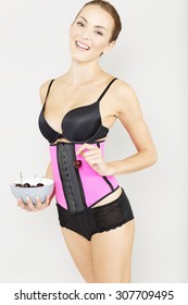 Young Woman Wearing A Waist Training Corset In Black Underwear Which Is The New Craze For Looking Slim