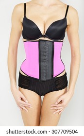 Young Woman Wearing A Waist Training Corset In Black Underwear Which Is The New Craze For Looking Slim