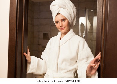 Young Woman Wearing A White Robe In The Hotel