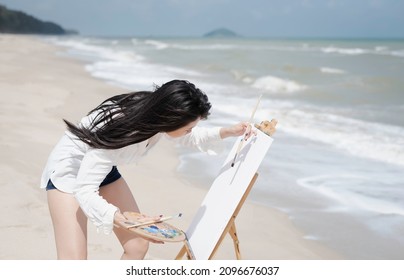 Young Woman Wearing White Shirt,painting On Canvas,relax Time,model Posing,blurry Light Around