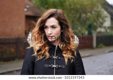 Image, Stock Photo contemplative young woman in winter jacket