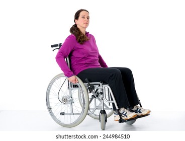 Young Woman In Wheelchair In Front Of White Background