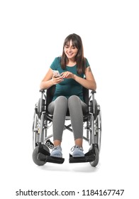 Young Woman In Wheelchair With Mobile Phone On White Background