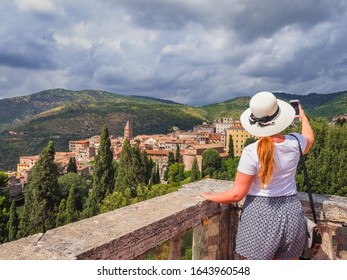 Young Woman With White Hat Taking Photos Of Tivoli. Aniene River Valley In The Background Of Sabine Hills. Cathedral, Basilica Di San Lorenzo Martire Or Duomo Di Tivoli In The Center. Storm Is Coming.