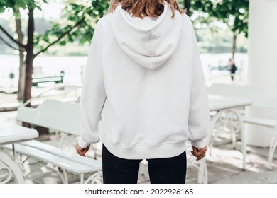 Young Woman In White Hoodie. Mockup, Back View. Lifestyle.