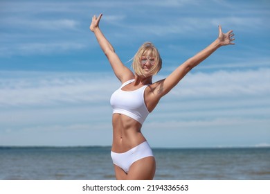 Young Woman In White Lingerie By The Sea