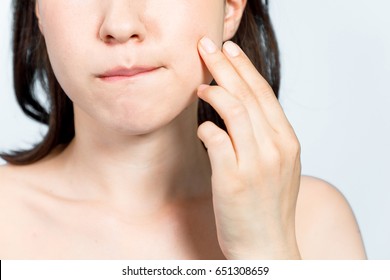 Young Woman Who Checks Her Skin. Acne Treatment.