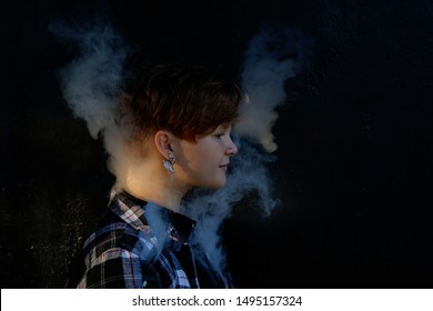 Young Woman Who Are Secretly Smoking At School. Smoking Girl.Vape Party. Sexy Young Woman With Glamorous Mystical Makeup Vaping In Nightclub (exhaling Smoke). 