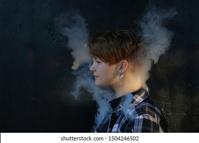 Young Woman Who Are Secretly Smoking At School. Smoking Girl.Vape Party. Sexy Young Woman With Glamorous Mystical Makeup Vaping In Nightclub (exhaling Smoke). 