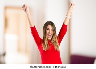 Young Woman Winner On Unfocused Background