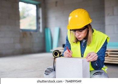 Young woman worker on the building site. - Powered by Shutterstock