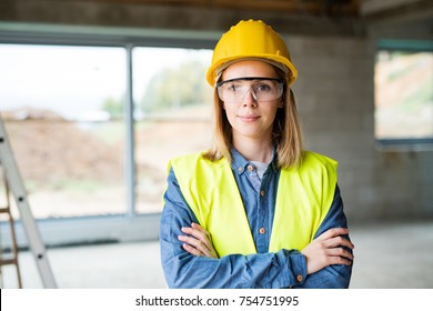 Young woman worker on the construction site. - Powered by Shutterstock