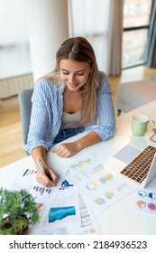 Young Woman Working Laptop. Business Woman Busy Working On Laptop Computer At Office. Businesswoman Sitting At Bright Modern Work Station And Typing On Laptop