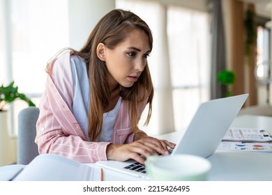 Young Woman Working Laptop. Business Woman Busy Working On Laptop Computer At Office. Businesswoman Sitting At Bright Modern Work Station And Typing On Laptop