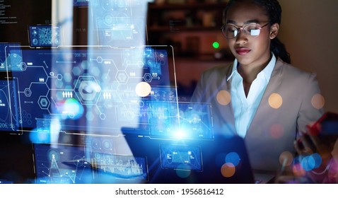 Young woman working in the night office. System engineering. Digital transformation.