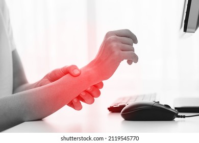 Young Woman Working In Office With A Carpal Tunnel Syndrome Or Wrist Joint Inflammation