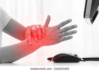 Young Woman Working In Office With A Carpal Tunnel Syndrome Or Wrist Joint Inflammation