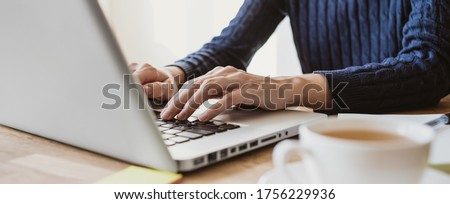 Young woman working in office. Student girl using laptop computer at home, panoramic banner. Business, studying, journalism, online shopping, freelance, distance learning, education concept