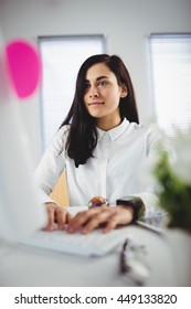 Young Woman Working On Computer In Office